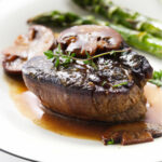 A steak diane recipe with mushrooms and cream butter sauce.