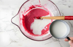 Mixing cake batter for strawberry jam cake.