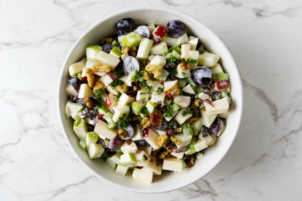 A bowl filled with apple celery salad.