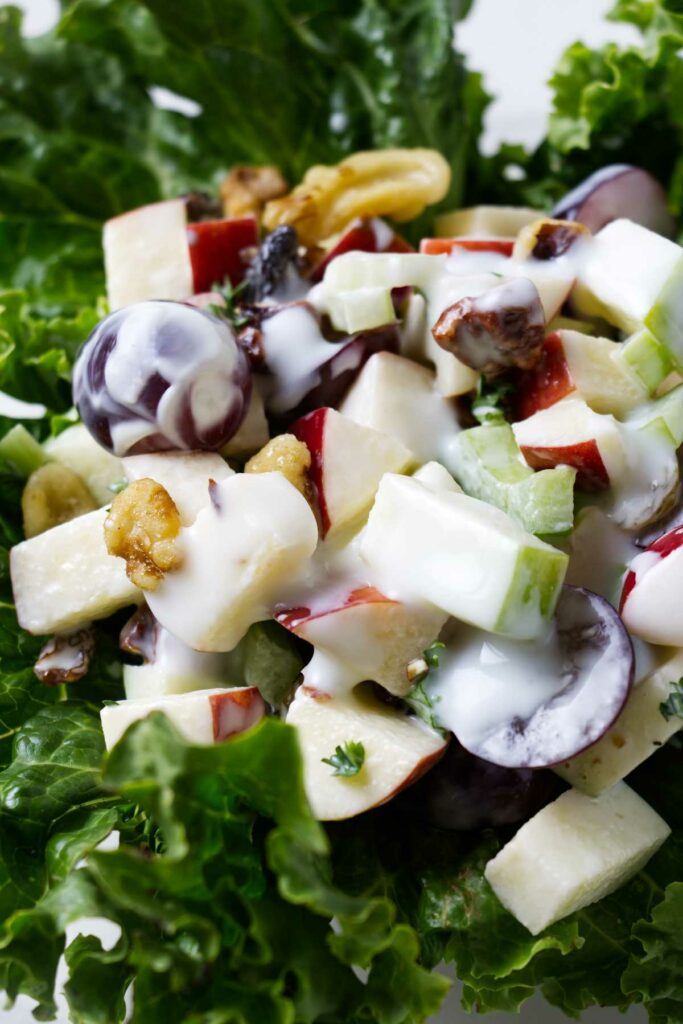Apple waldorf salad on a bed of lettuce.