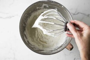 Whipped cream in a mixing bowl.