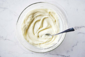 stirring melted white chocolate as it sets up.