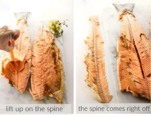 Removing the spine and bones from a baked salmon.