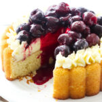 A sponge cake with mousseline cream and topped with cherry compote.
