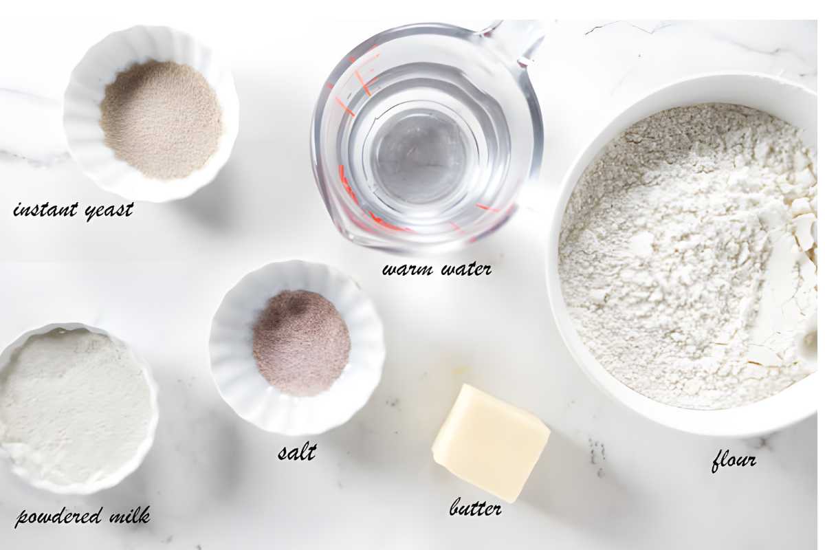 Baking ingredients for fry bread arranged on a white surface, viewed from above.