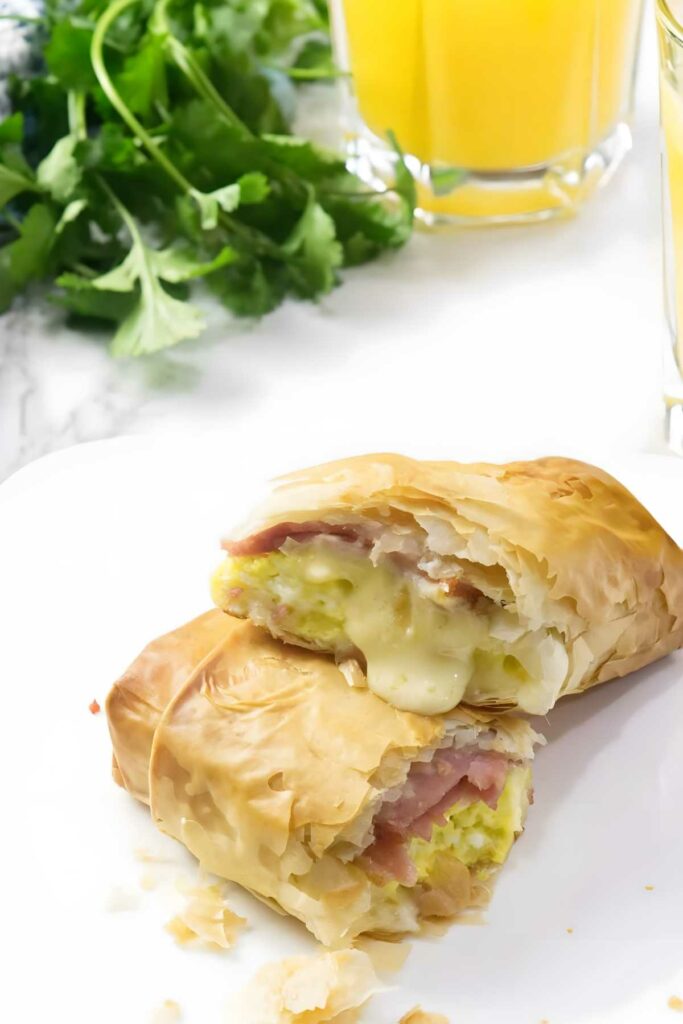 Phyllo pastry roll with cheese, ham, and herbs. 