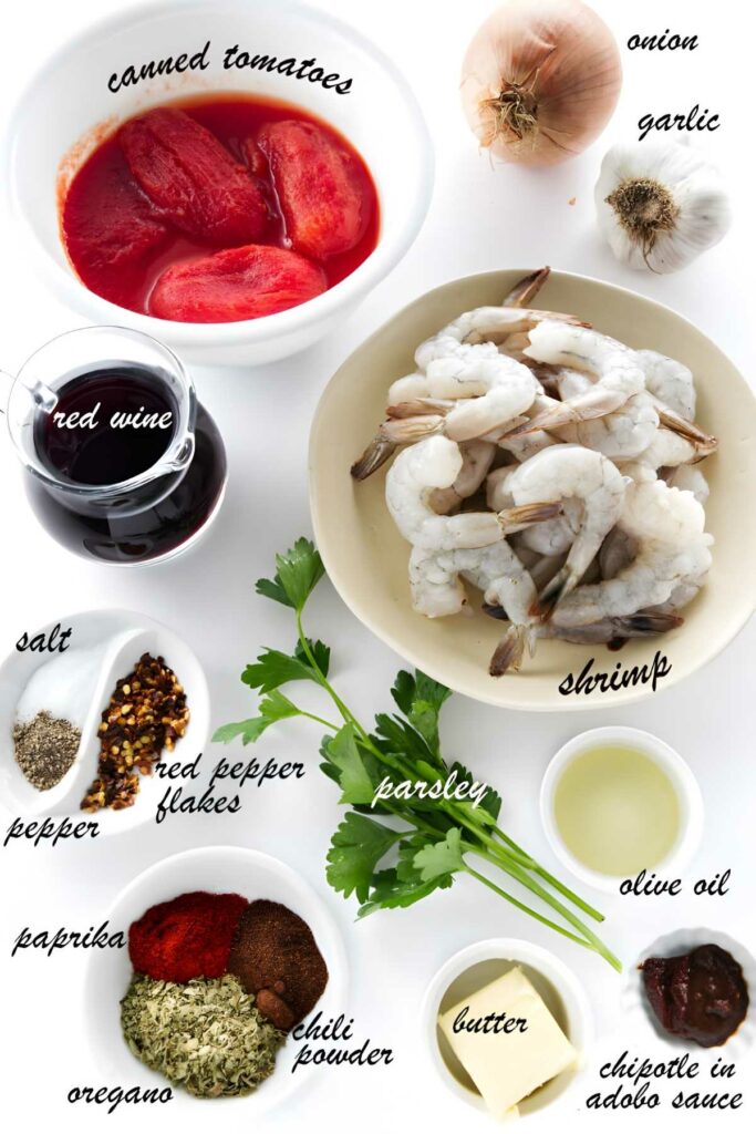 Overhead view of shrimp with various recipe ingredients arranged around it.