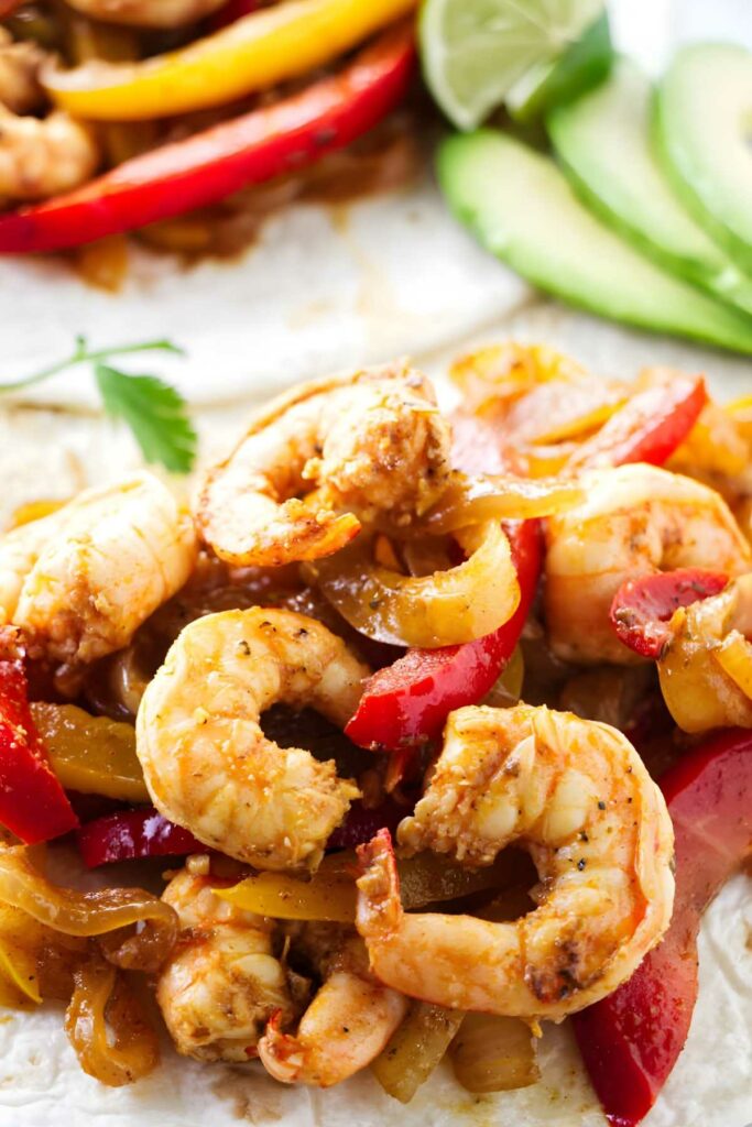 Spicy shrimp and peppers for a wrap and serve family style fajita dinner.