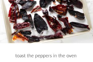 Toasting chile peppers in a sheet pan.