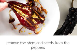 Removing seeds and stems from a dried chile pepper.