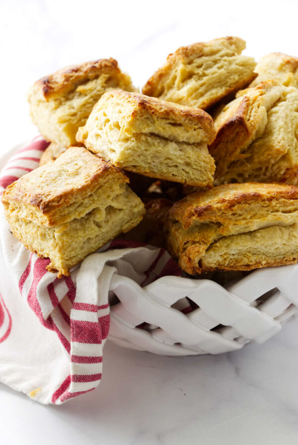 A bowl filled with biscuits made from scratch.