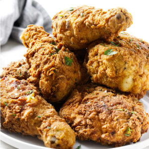 A plate filled with southern fried chicken brined in buttermilk.