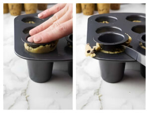 Pressing chocolate chip cookie dough in cookie shooter molds.
