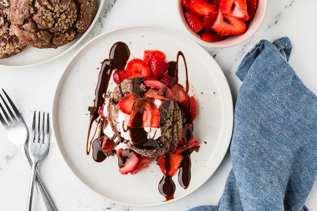 A sourdough strawberry shortcake with chocolate sauce.