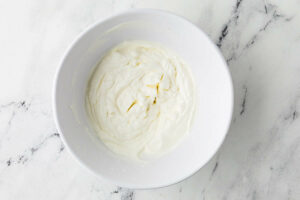 Whipping cream with sugar and vanilla extract.