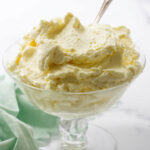 Mousseline cream in a dish with a spoon.
