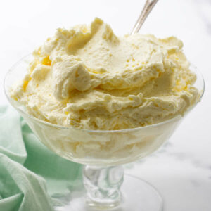 Mousseline cream in a dish with a spoon.