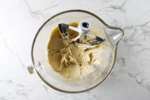 Creaming butter and sugar in a mixing bowl.