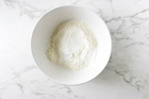 Mixing the dry ingredients in a mixing bowl.