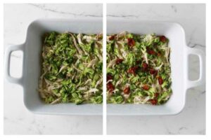 Divided dish with shredded chicken, broccoli, and sun-dried tomatoes on marble.
