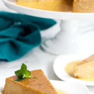 A caramel pumpkin flan slice with mint garnish.