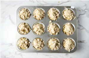 Topping muffin batter with a streusel topping.