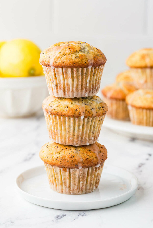 A stack of three lemon sourdough poppyseed muffins.