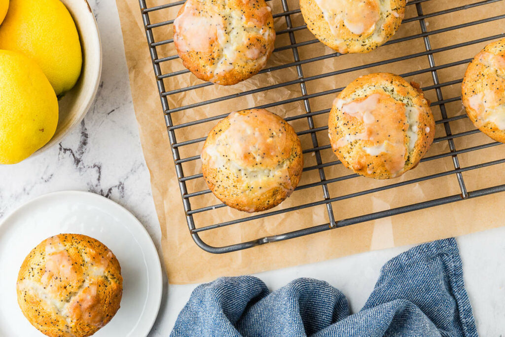 Several muffins cooling on a wire rack.