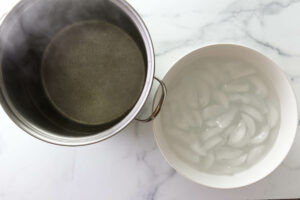 Heating a pot of hot water and prepping a bowl of ice water for the tomatoes.