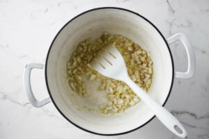 Sauteeing onions in a pot.