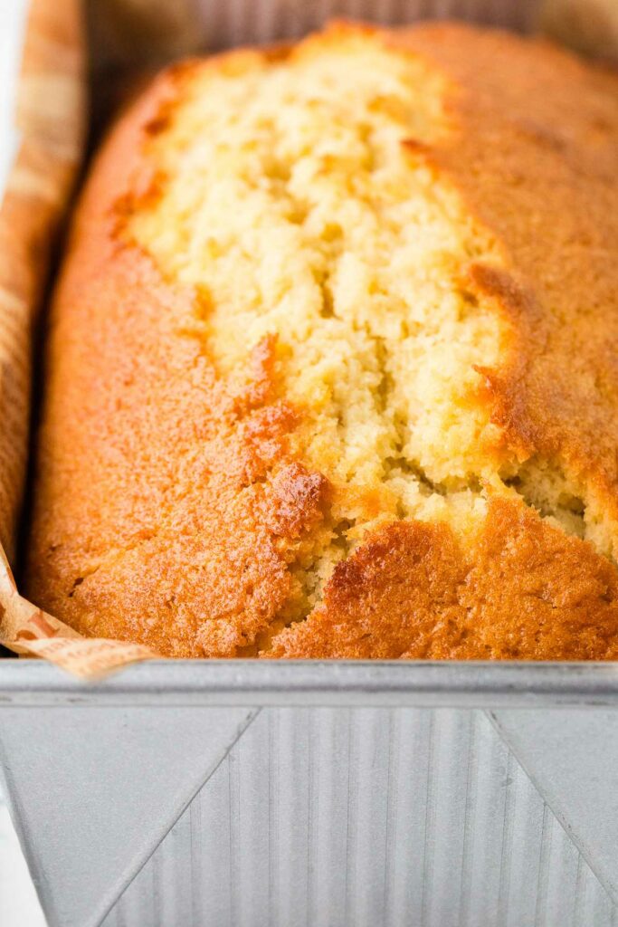 A freshly baked pound cake in a loaf pan.