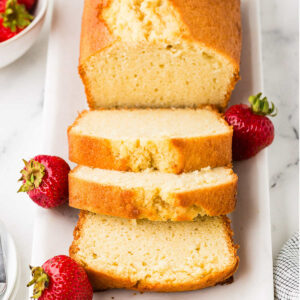 A partially sliced pound cake made with sourdough discard.