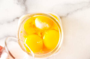 Egg yolks in a jar for an immersion blender.