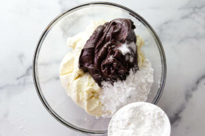 Mixing chocolate with ricotta and powdered sugar.