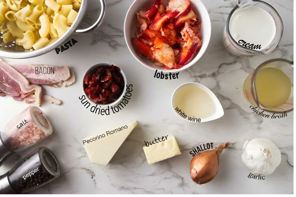 Assorted pasta dish ingredients arranged on a marble surface.