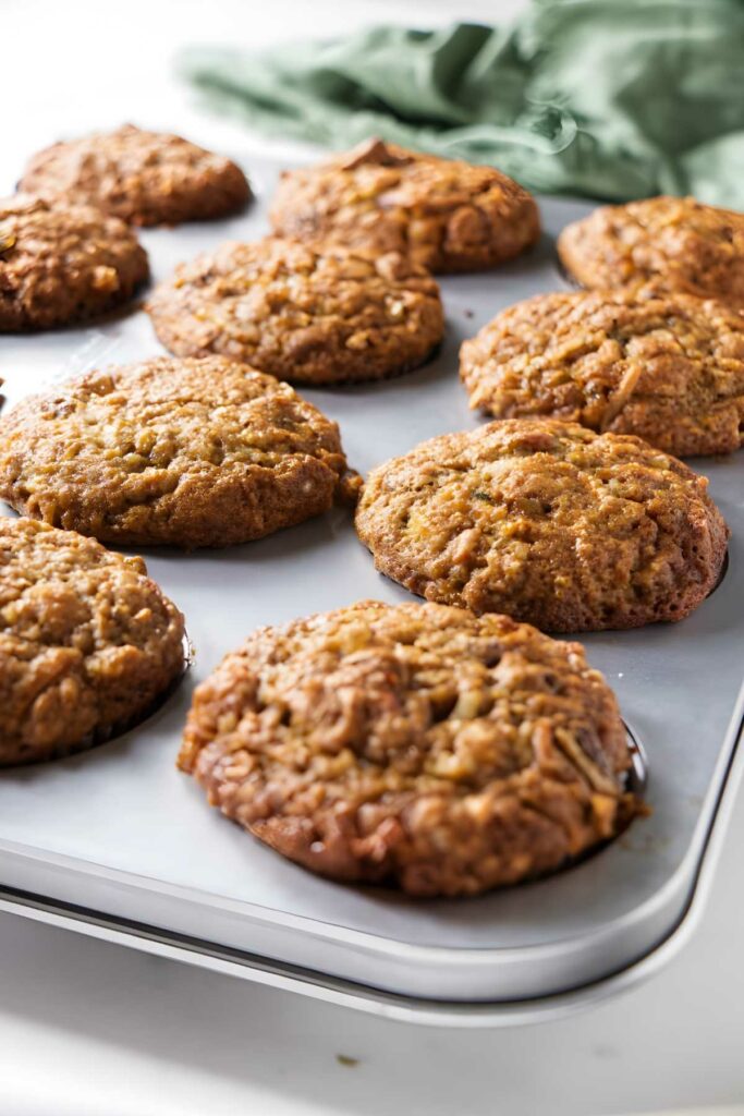 Morning glory muffins cooling on a tray.