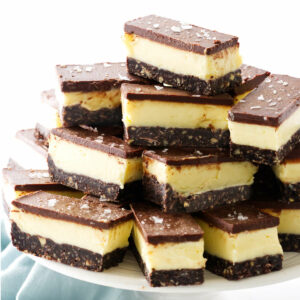 Several Canadian nanaimo bars on a dessert platter.