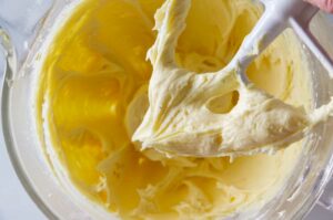 Mixing the buttercream in a bowl.