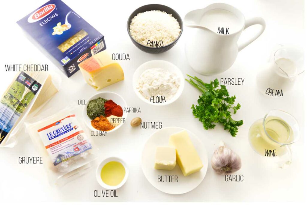 Top-down view of mac and cheese ingredients, including pasta, cheeses, and spices.