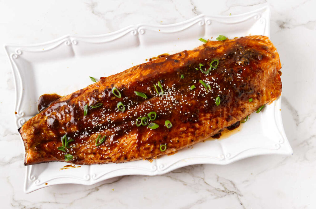 A side of salmon topped with a garlic ginger soy glaze.