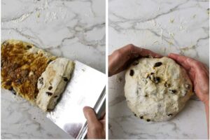 Rolling cinnamon raisin bread dough into a ball on a floured counter.