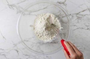 Whisking the dry ingredients in a bowl.