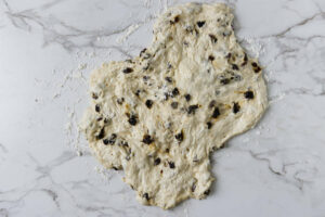 stretching the dough into a rough rectangle.