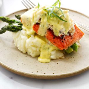 Crab and salmon oscar on a bed of mashed potatoes.