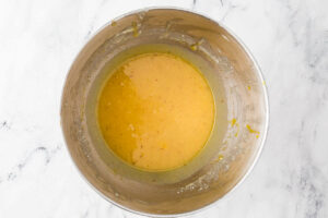 Mixing the wet ingredients for a sourdough sugar cookie recipe.