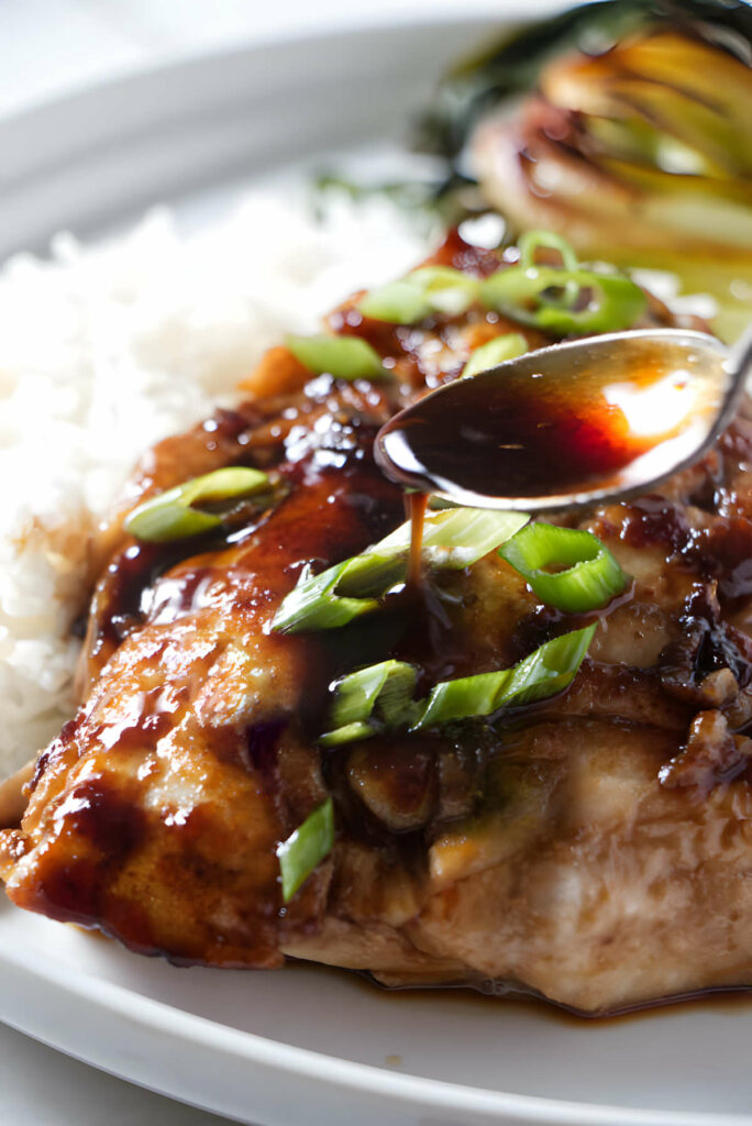 Spooning sauce over a pan seared rockfish fillet.