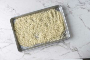 Bread crumbs on a baking sheet.