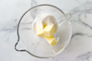 Butter and sugar in a mixing bowl.