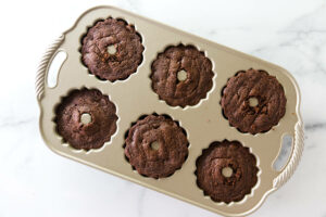 Mint chocolate bundt cakes in a mini bundt cake pan.