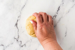 Kneading pasta dough by hand.